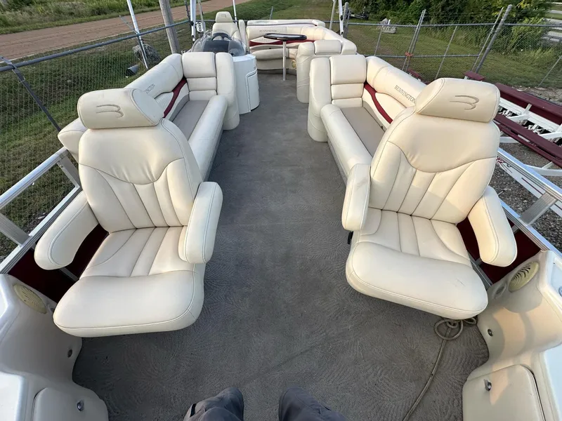 Slide: The Image of 2009 Bennington 2577RFi pontoon boat interior with plush seating and spacious layout. - 8