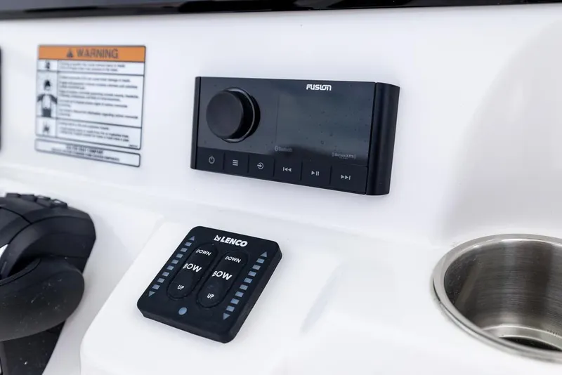 Slide: The Image of Control panel on 2026 Sea Fox 268 Commander boat, featuring Fusion audio system and Lenco trim tab controls. - 14