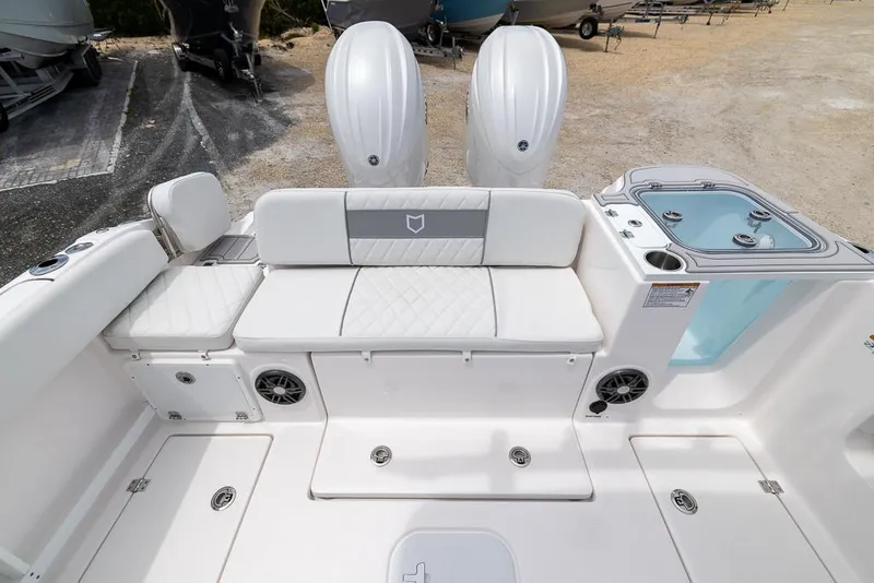 Slide: The Image of 2026 Sea Fox 268 Commander boat interior with seating, speakers, and storage compartments. - 7