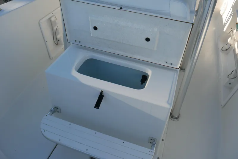 Slide: The Image of KenCraft Challenger 21 boat interior, featuring a storage compartment and seating, 2018 model. - 17