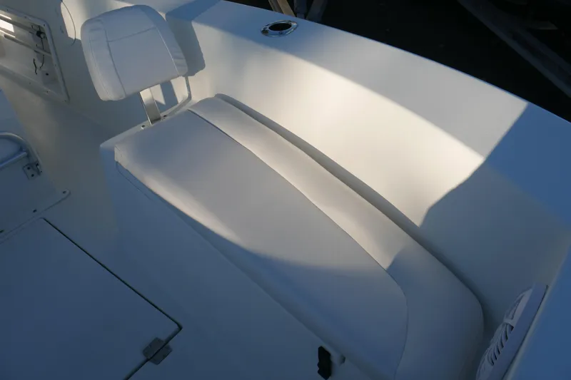 Slide: The Image of 2018 KenCraft Challenger 21 boat interior with white seating and cup holder. - 19