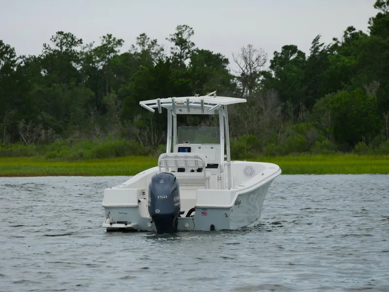 Slide: The Image of 2018 KenCraft Challenger 21 boat on water with Yamaha outboard motor. - 2
