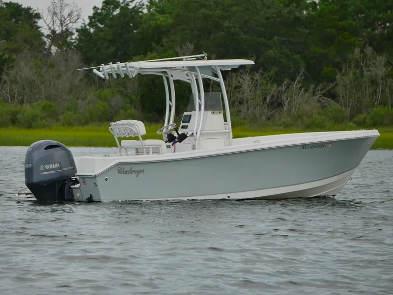 Slide: The Image of 2018 KenCraft Challenger 21 boat on water, surrounded by lush greenery. - 3
