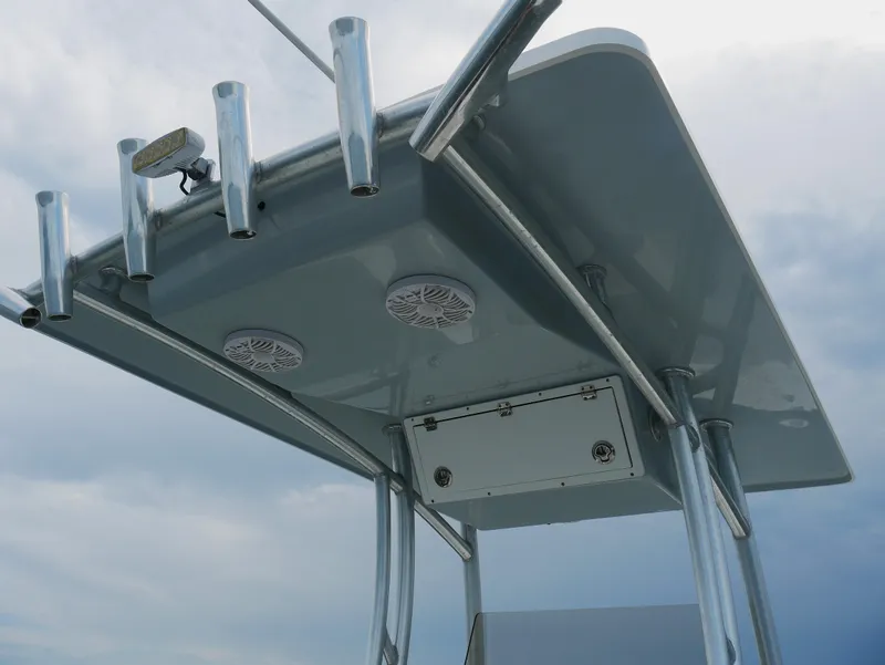 Slide: The Image of 2018 KenCraft Challenger 21 boat interior with white seating and storage compartments. - 8