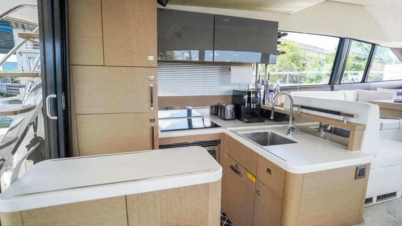 Slide: The Image of Modern kitchen interior on a 2018 Prestige 500 Flybridge yacht. - 14