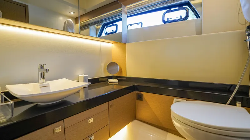 Slide: The Image of Luxurious bathroom in 2018 Prestige 500 Flybridge yacht with modern fixtures and elegant design. - 23