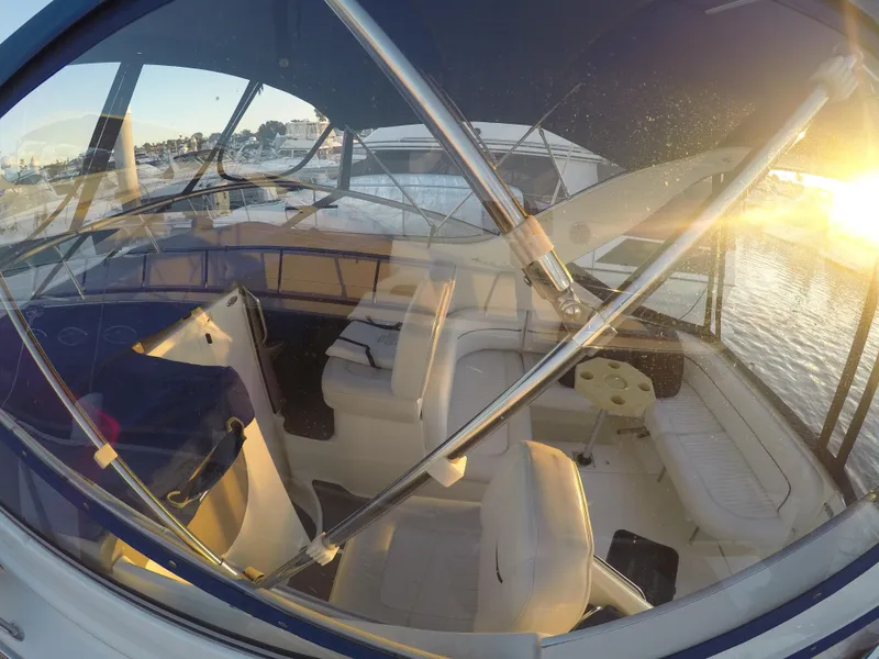 Slide: The Image of 2001 Bayliner 3055 Ciera boat interior with sunset view through windows. - 4