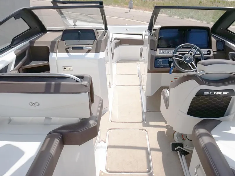 Slide: The Image of 2022 Cobalt R6 Surf boat interior with modern dashboard and seating. - 15