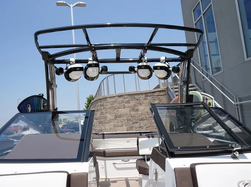 Slide: The Image of 2022 Cobalt R6 Surf boat interior with wakeboard tower and speakers. - 24