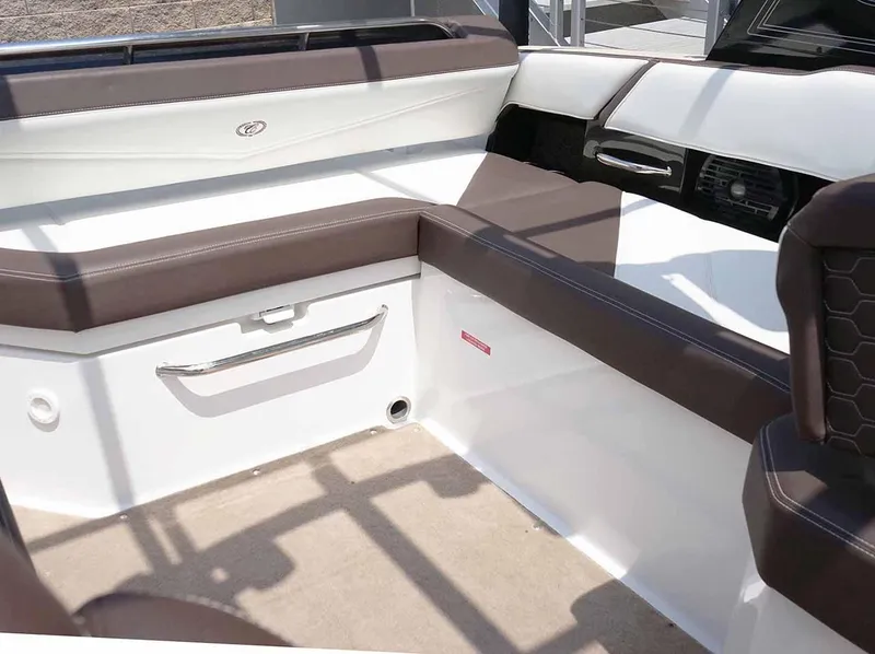Slide: The Image of 2022 Cobalt R6 Surf boat interior with brown and white seating. - 9