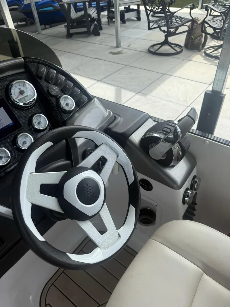 Slide: The Image of Steering console of a 2019 PlayCraft 29 Infinity boat with gauges and controls. - 3