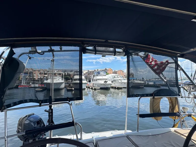 Slide: The Image of View from a 2005 Beneteau Oceanis Clipper 473, overlooking a marina with boats and buildings. - 14