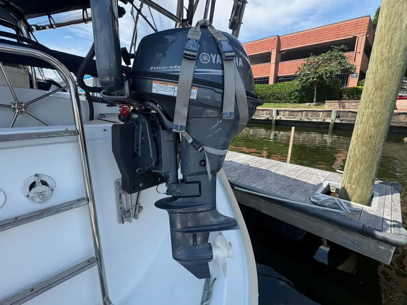 Slide: The Image of Yamaha outboard motor on 2005 Beneteau Oceanis Clipper 473 sailboat, docked by a marina. - 27