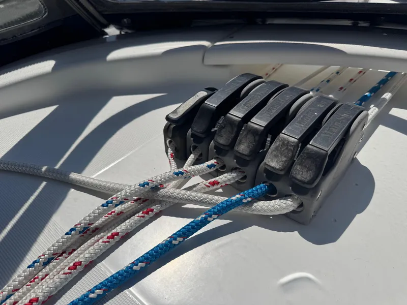 Slide: The Image of Rope clutches on a 2005 Beneteau Oceanis Clipper 473 sailboat deck. - 28