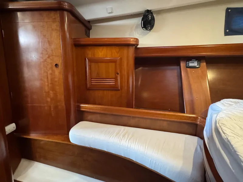 Slide: The Image of Interior of 2005 Beneteau Oceanis Clipper 473, featuring wooden cabinetry and seating. - 45