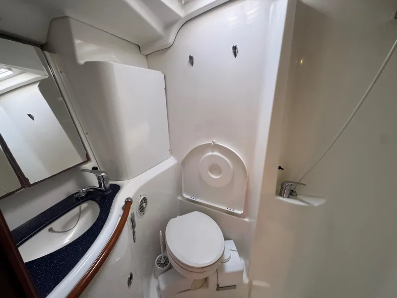Slide: The Image of Bathroom interior of 2005 Beneteau Oceanis Clipper 473 yacht, featuring sink and toilet. - 49