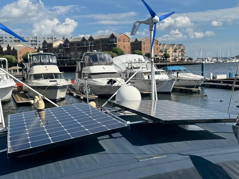 Slide: The Image of Beneteau Oceanis Clipper 473 with solar panels and wind turbine in a marina, 2005 model. - 6