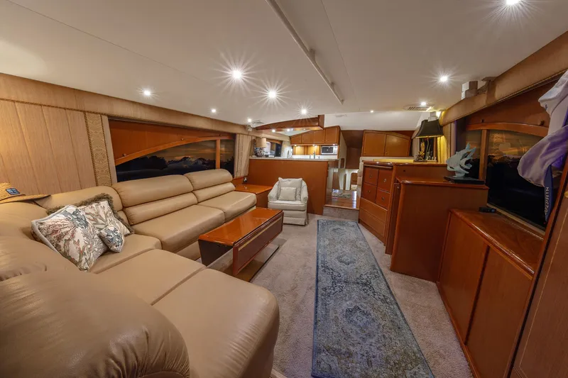 Slide: The Image of Luxurious interior of 2004 Ocean Yachts 57 Convertible, featuring elegant seating and wooden cabinetry. - 12