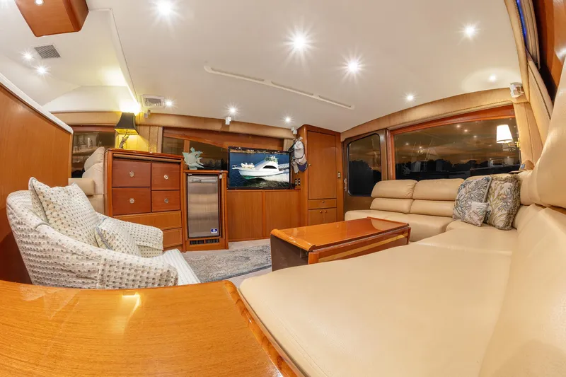 Slide: The Image of Luxurious interior of 2004 Ocean Yachts 57 Convertible with plush seating and elegant wood finishes. - 16