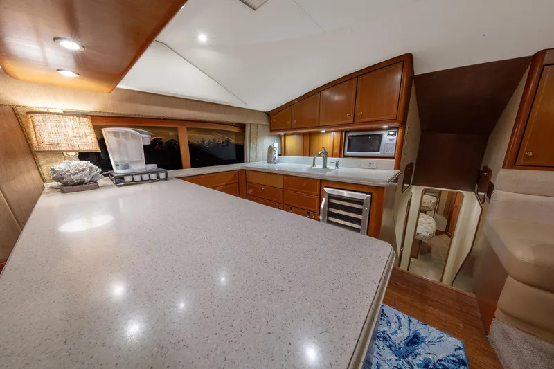 Slide: The Image of Luxurious kitchen interior of 2004 Ocean Yachts 57 Convertible with modern amenities. - 17