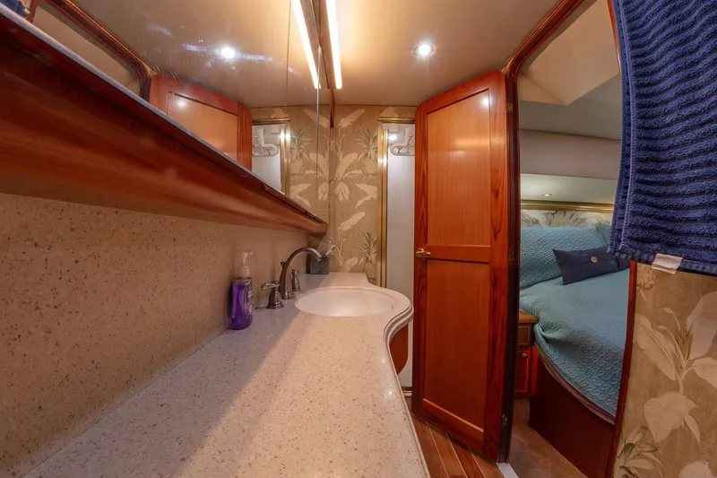 Slide: The Image of Luxurious bathroom interior of 2004 Ocean Yachts 57 Convertible with elegant wood finishes. - 24