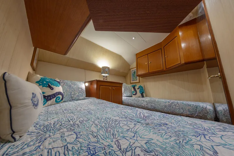 Slide: The Image of Luxurious cabin interior of 2004 Ocean Yachts 57 Convertible with nautical-themed decor. - 30
