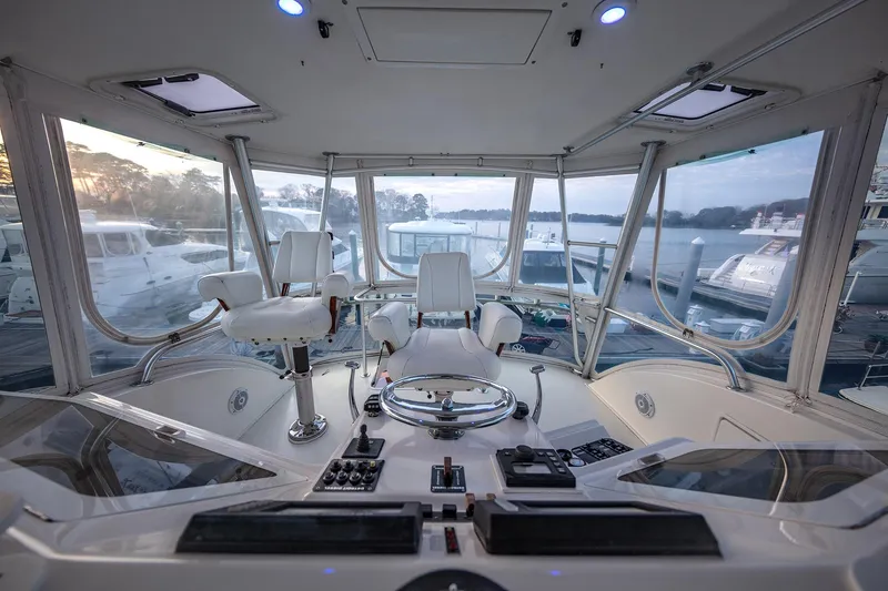 Slide: The Image of Cockpit view of 2004 Ocean Yachts 57 Convertible, featuring helm and controls. - 35