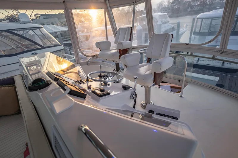 Slide: The Image of Luxurious helm of 2004 Ocean Yachts 57 Convertible with sunset view. - 36