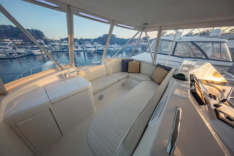 Slide: The Image of Luxurious 2004 Ocean Yachts 57 Convertible interior with marina view. - 38