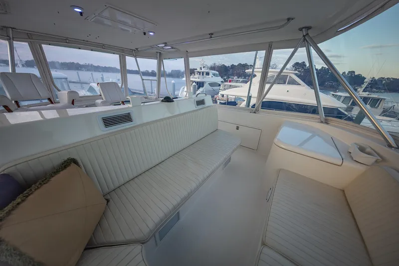Slide: The Image of Luxurious interior of 2004 Ocean Yachts 57 Convertible, featuring spacious seating and panoramic windows. - 39