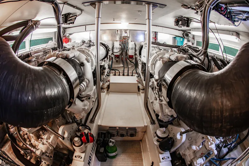 Slide: The Image of Engine room of a 2004 Ocean Yachts 57 Convertible, showcasing dual powerful engines. - 47