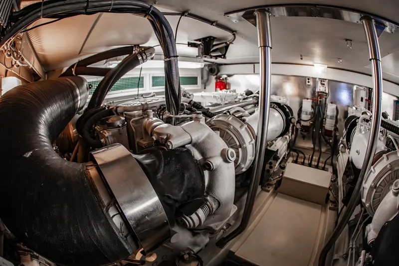 Slide: The Image of Engine room of 2004 Ocean Yachts 57 Convertible, showcasing mechanical components and systems. - 49