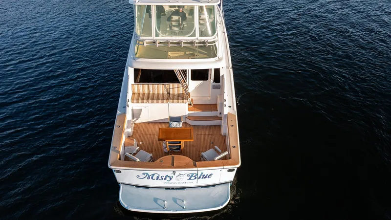 Slide: The Image of 2004 Ocean Yachts 57 Convertible on water, aerial view, elegant deck design. - 7