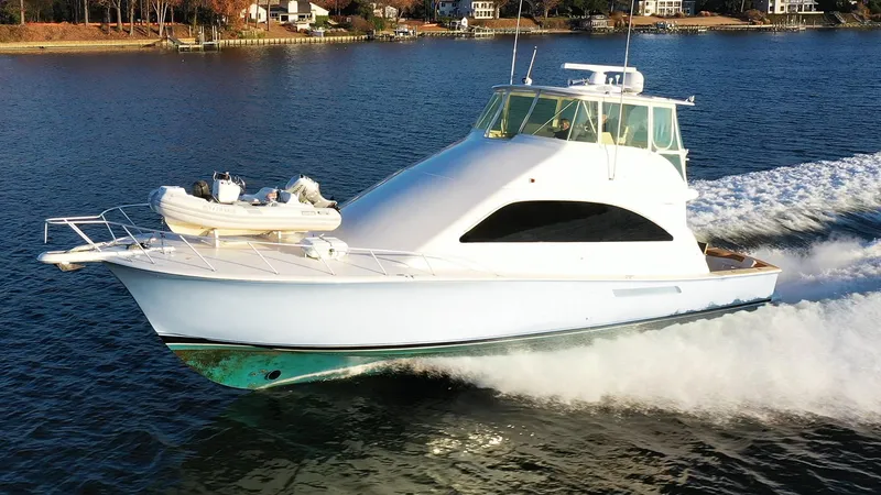 Slide: The Image of 2004 Ocean Yachts 57 Convertible cruising on a serene waterway. - 9