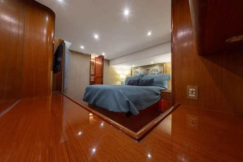Slide: The Image of Luxurious cabin interior of 2004 Ocean Yachts 57 Convertible with wood finish and cozy bedding. - 23