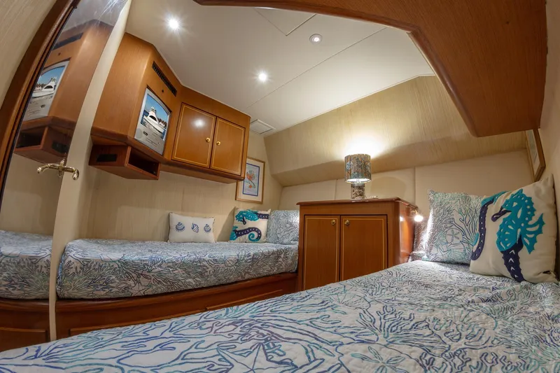 Slide: The Image of Luxurious cabin interior of 2004 Ocean Yachts 57 Convertible with nautical-themed decor. - 31
