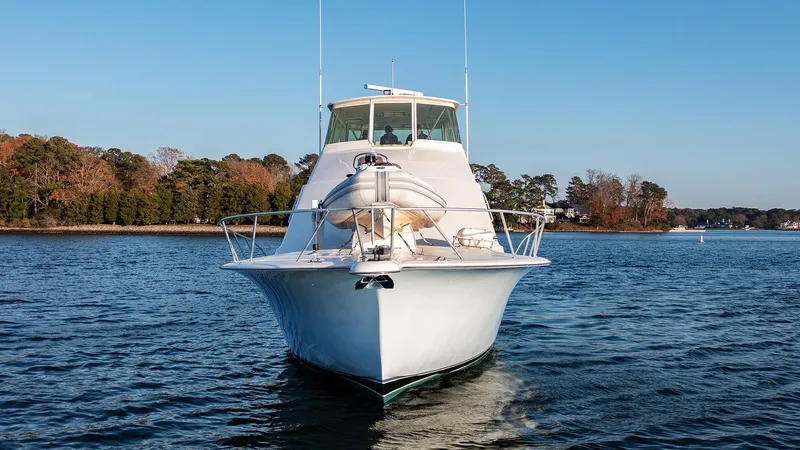 Slide: The Image of 2004 Ocean Yachts 57 Convertible on calm water, front view. - 5