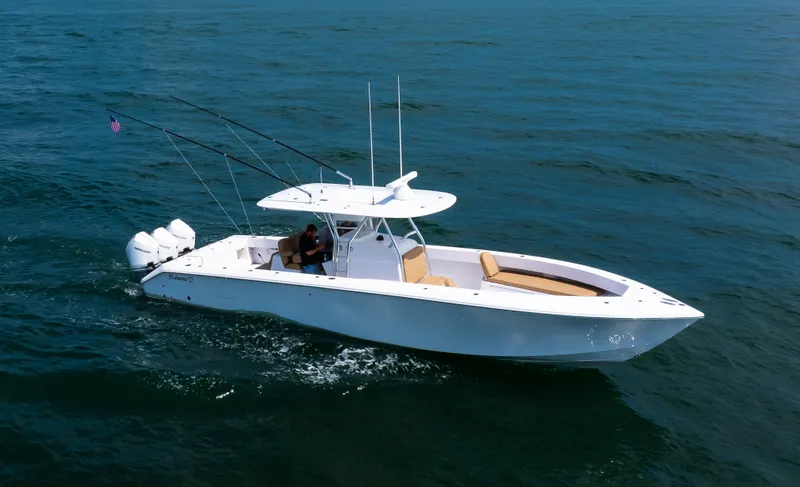 Slide: The Image of 2025 Bahama 37 Super Center Console boat cruising on open water. - 10