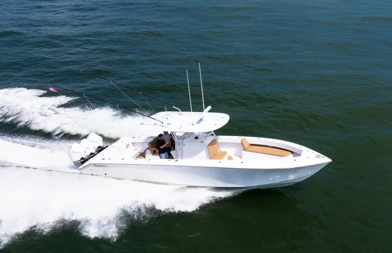 Slide: The Image of 2025 Bahama 37 Super Center Console cruising on open water, showcasing sleek design and performance. - 4