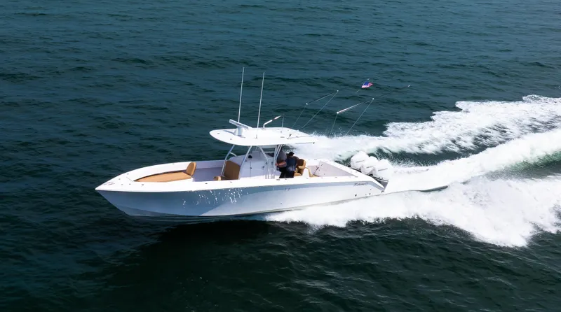 Slide: The Image of 2025 Bahama 37 Super Center Console cruising on open water. - 6