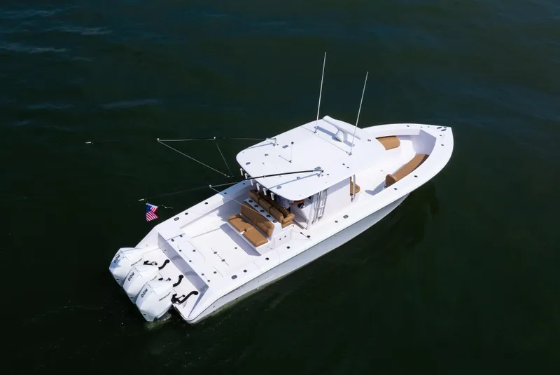 Slide: The Image of 2025 Bahama 37 Super Center Console boat on calm water, aerial view. - 9