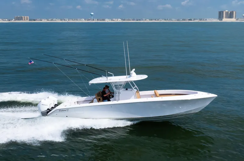 Slide: The Image of 2025 Bahama 37 Super Center Console cruising on open water. - 2