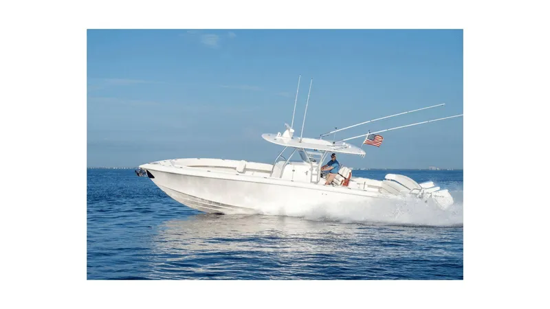 Slide: The Image of 2024 Bahama 37 Super Center Console boat cruising on open water. - 21
