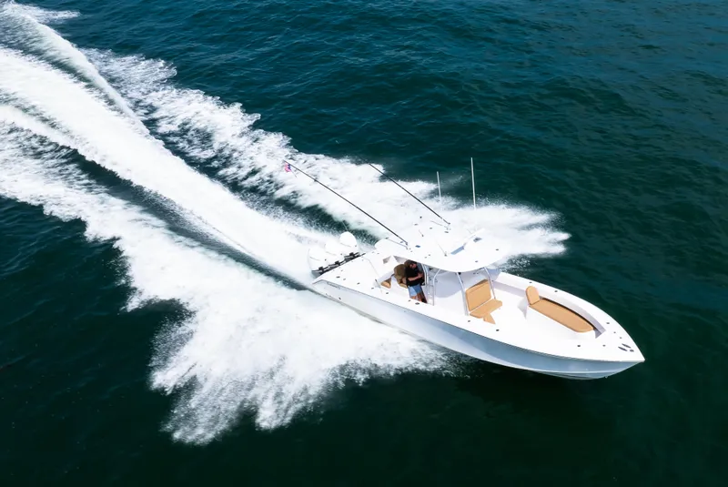 Slide: The Image of 2025 Bahama 37 Super Center Console speeding on open water. - 5