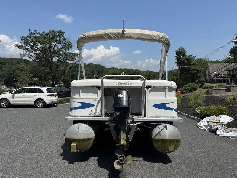 Slide: The Image of 2006 Bentley Pontoons 240 CRUISE boat parked outdoors on a sunny day. - 1