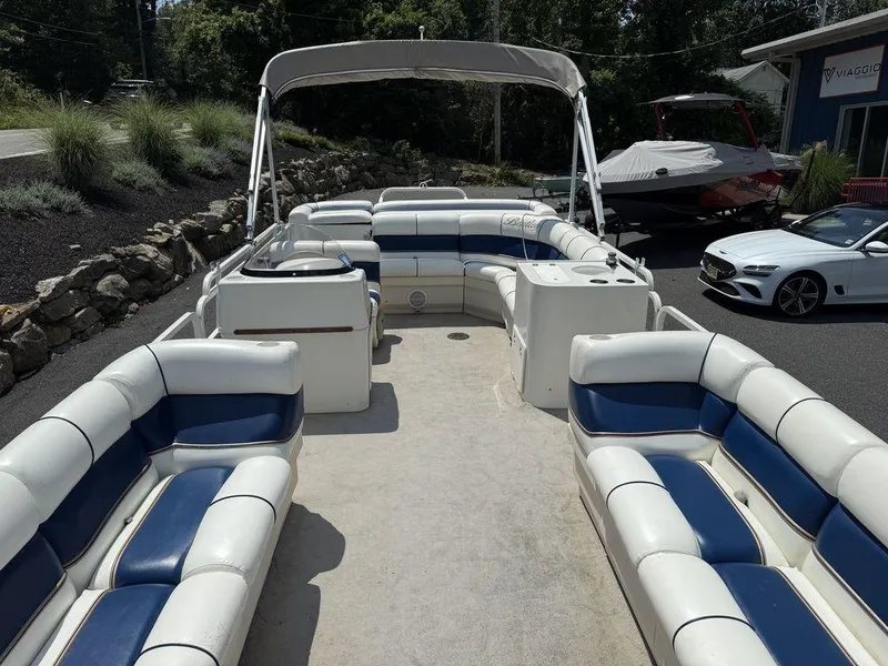 Slide: The Image of 2006 Bentley Pontoons 240 CRUISE with spacious seating and canopy, parked outdoors. - 11