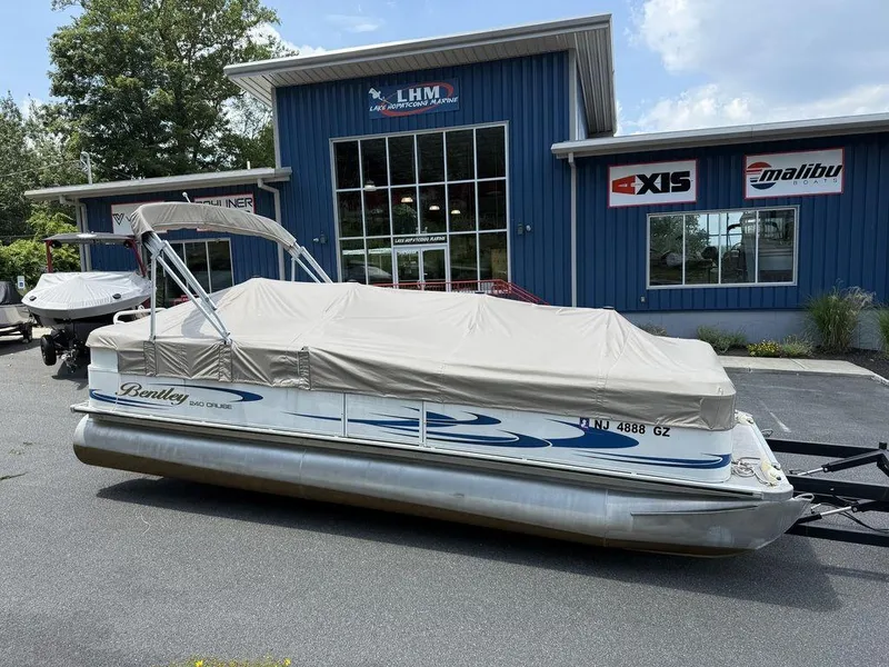Slide: The Image of 2006 Bentley Pontoons 240 CRUISE covered, parked outside LHM Marine building. - 14
