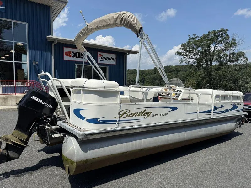 Slide: The Image of 2006 Bentley Pontoons 240 CRUISE boat with Mercury engine, parked outdoors. - 3