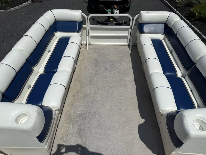 Slide: The Image of 2006 Bentley Pontoons 240 CRUISE interior with white and blue seating. - 6