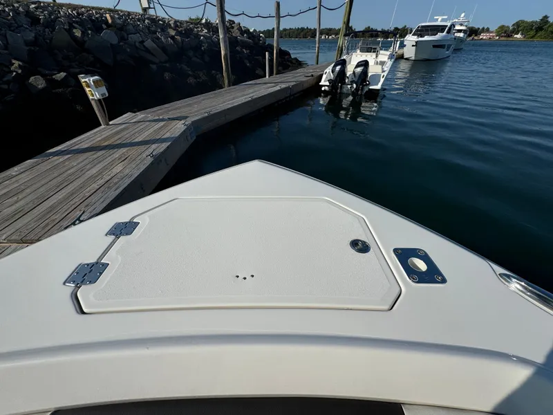 Slide: The Image of Bow view of 2023 Sailfish 312 CC boat docked at marina. - 16